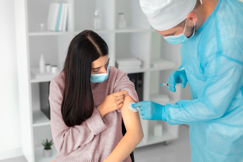 Staying Healthy During Cold & Flu Season: What Actually Works? women getting vaccination