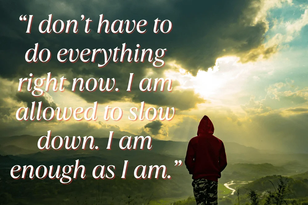 What to Do When You’re Feeling Overwhelmed (Simple Wellness Practices) a man standing o a hill lookin down and a affirmation written